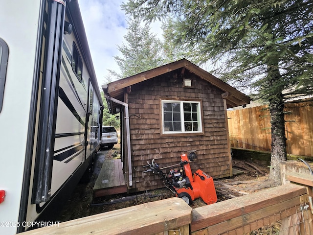 1902 Swetmann Ave, Seward, AK 99664 - view of side of property featuring fence and an outbuilding