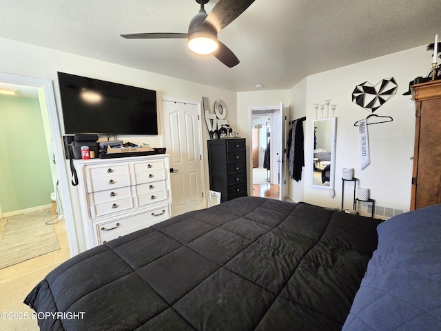 1902 Swetmann Ave, Seward, AK 99664 - bedroom featuring a ceiling fan and connected bathroom