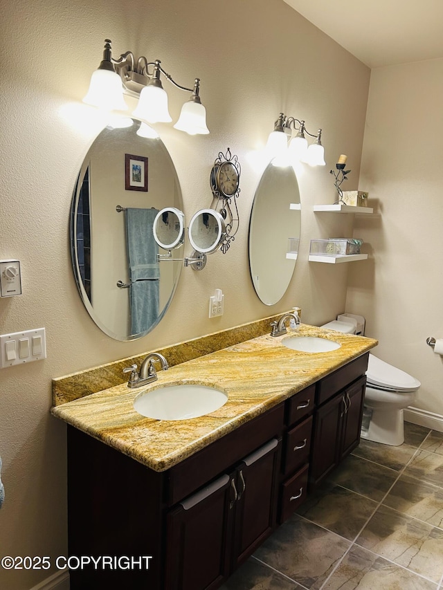 5789 S Hanson Loop, Wasilla, AK 99654 - bathroom featuring toilet, double vanity, and a sink