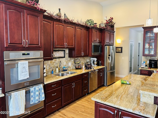 5789 S Hanson Loop, Wasilla, AK 99654 - kitchen with tasteful backsplash, stainless steel appliances, dark brown cabinets, and a sink
