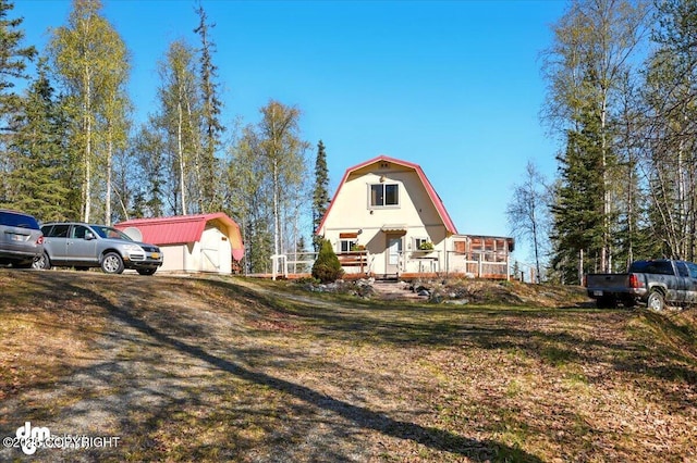 8266 S Big Lake Rd, Big Lake, AK 99652 - view of side of property featuring a gambrel roof and an outbuilding