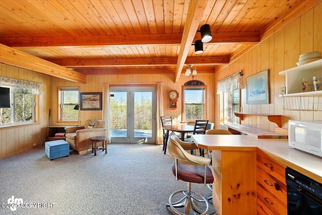 8266 S Big Lake Rd, Big Lake, AK 99652 - kitchen featuring dishwasher, white microwave, wood walls, beamed ceiling, and wood ceiling