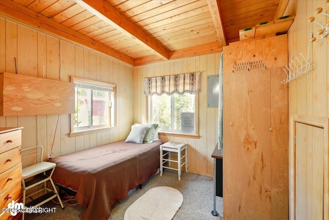 8266 S Big Lake Rd, Big Lake, AK 99652 - carpeted bedroom featuring wooden ceiling, wood walls, and beam ceiling