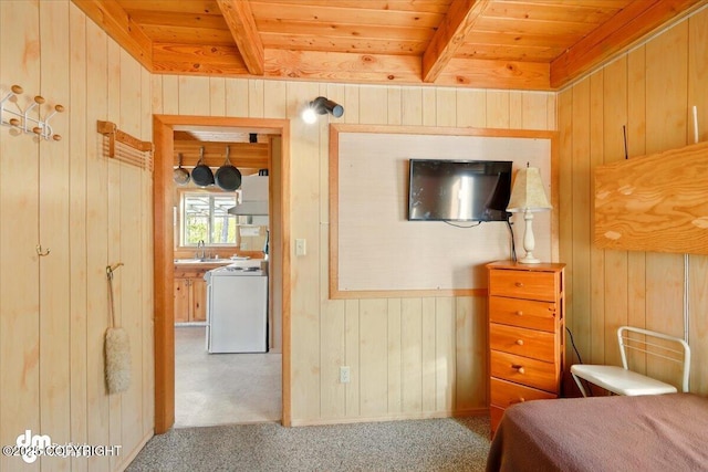8266 S Big Lake Rd, Big Lake, AK 99652 - carpeted bedroom with wooden walls, wooden ceiling, beam ceiling, and a sink