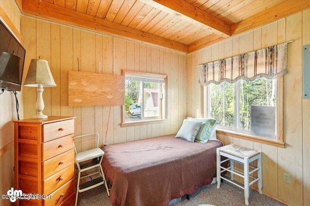 8266 S Big Lake Rd, Big Lake, AK 99652 - carpeted bedroom featuring wooden ceiling, wood walls, multiple windows, and beamed ceiling