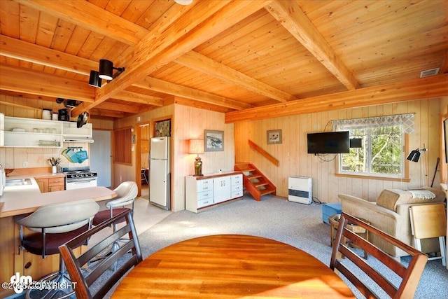8266 S Big Lake Rd, Big Lake, AK 99652 - carpeted living area with beam ceiling, a sink, wood walls, wood ceiling, and stairs