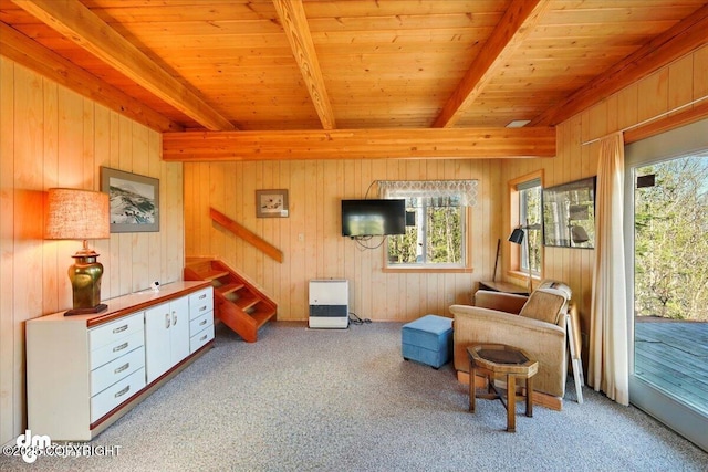 8266 S Big Lake Rd, Big Lake, AK 99652 - living area featuring beam ceiling, carpet, wooden walls, wood ceiling, and stairs