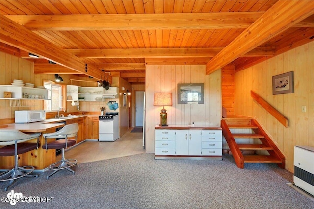 8266 S Big Lake Rd, Big Lake, AK 99652 - kitchen with white appliances, open shelves, beamed ceiling, wooden walls, and wood ceiling
