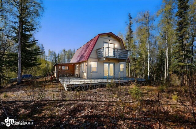 8266 S Big Lake Rd, Big Lake, AK 99652 - rear view of property with a balcony and a gambrel roof