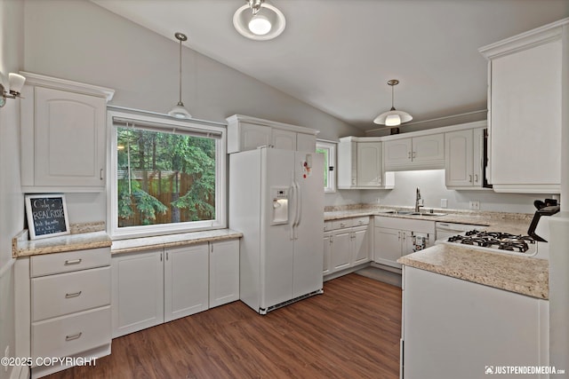 6700 Omalley Rd, Anchorage, AK 99507 - kitchen featuring white appliances, a sink, lofted ceiling, white cabinets, and decorative light fixtures