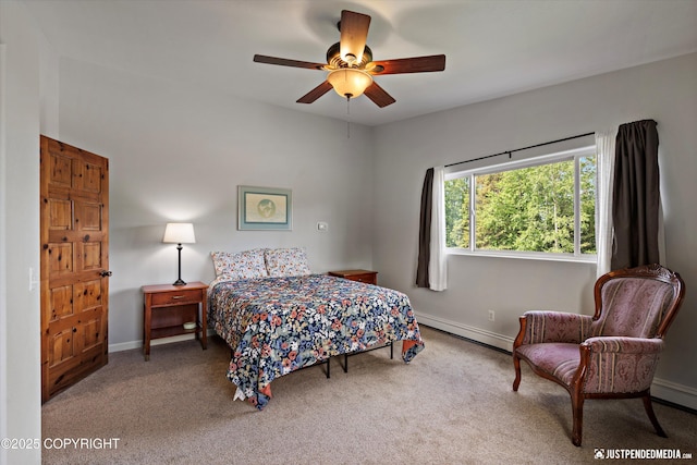 6700 Omalley Rd, Anchorage, AK 99507 - bedroom with a baseboard heating unit, carpet flooring, baseboards, and a ceiling fan