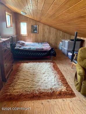 35290 Fisherman Rd, Soldotna, AK 99669 - bedroom featuring wood walls, wood finished floors, lofted ceiling, and wood ceiling
