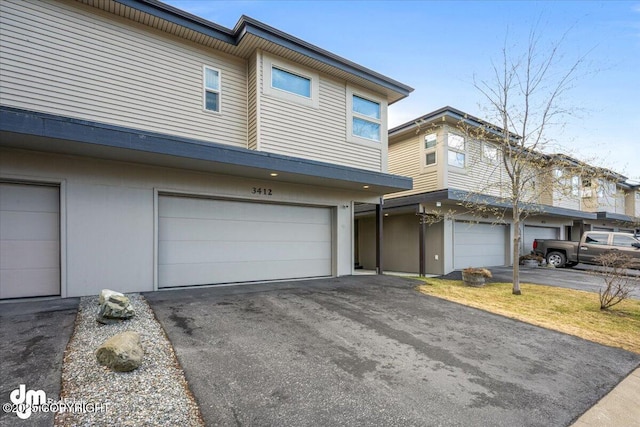 3412 Red Rock Ct, Anchorage, AK 99502 - multi unit property featuring an attached garage and driveway