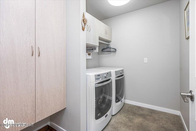 3412 Red Rock Ct, Anchorage, AK 99502 - washroom featuring washer and dryer, baseboards, carpet flooring, and cabinet space