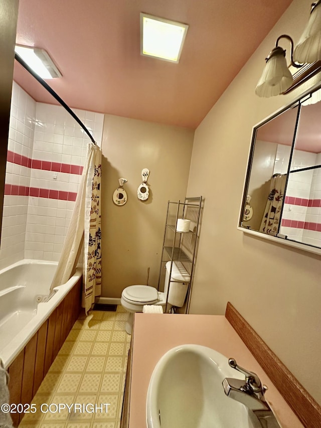 33434 Nash Rd, Seward, AK 99664 - full bathroom featuring vanity, toilet, tile patterned floors, and shower / tub combo