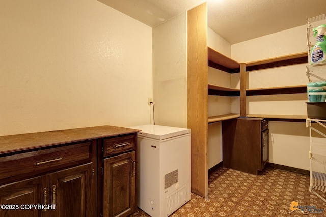 laundry area featuring light flooring