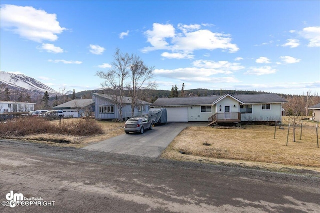 8000 Cox Dr, Anchorage, AK 99516 - single story home with aphalt driveway, a front lawn, and an attached garage