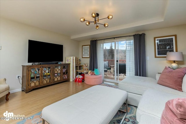 8000 Cox Dr, Anchorage, AK 99516 - living room featuring wood finished floors and a chandelier