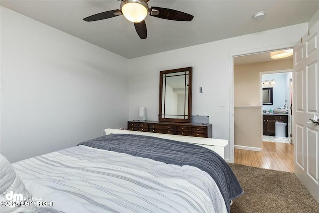 8000 Cox Dr, Anchorage, AK 99516 - bedroom with ceiling fan, light wood-style flooring, and light carpet
