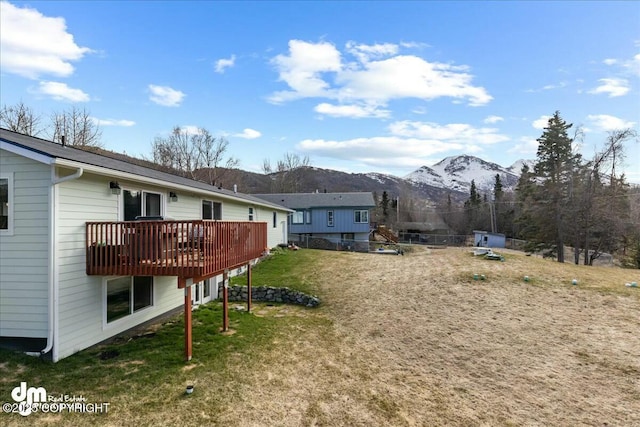 8000 Cox Dr, Anchorage, AK 99516 - view of yard featuring a deck with mountain view