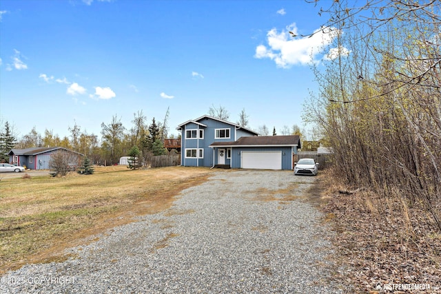 chalet / cabin with fence, a front lawn, a garage, board and batten siding, and driveway