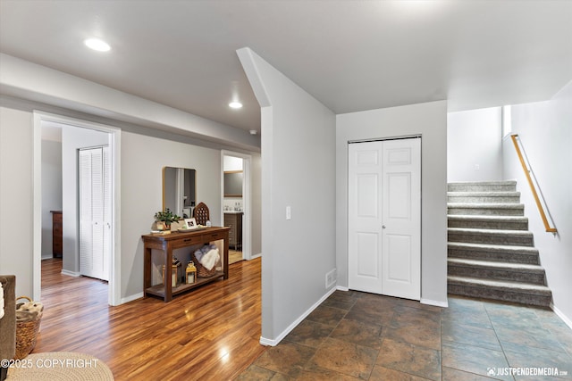 interior space featuring baseboards and recessed lighting