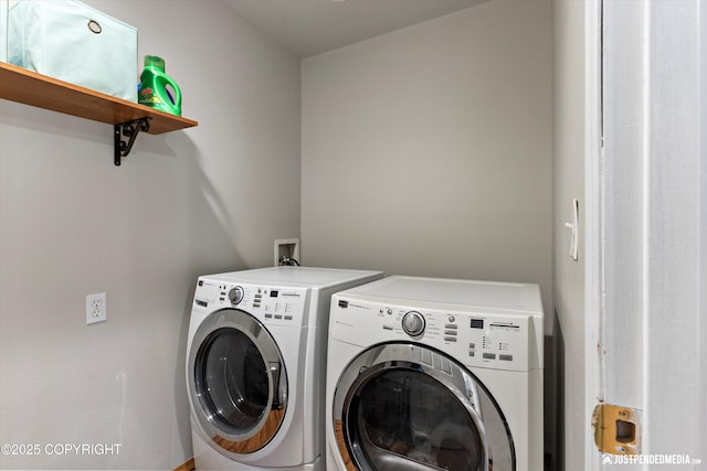 clothes washing area with laundry area and washer and clothes dryer