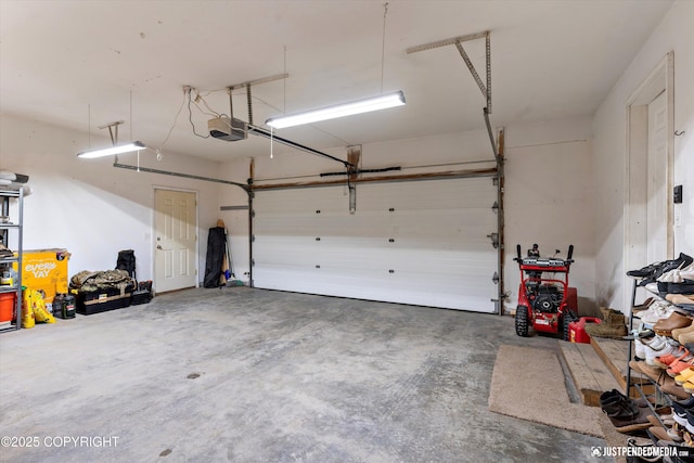 garage featuring a garage door opener