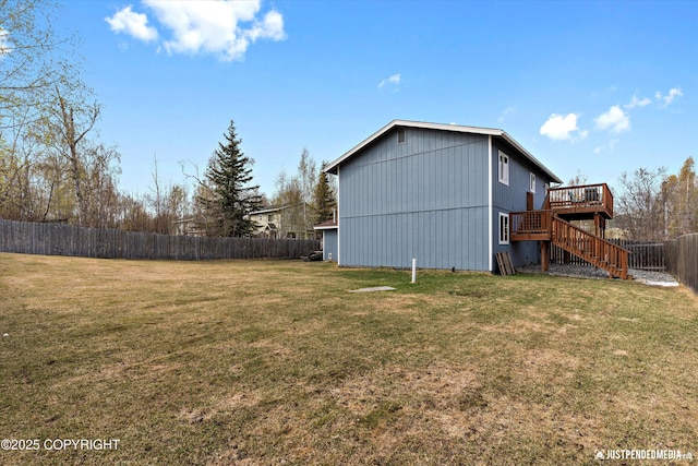 exterior space with a fenced backyard, a deck, and stairway