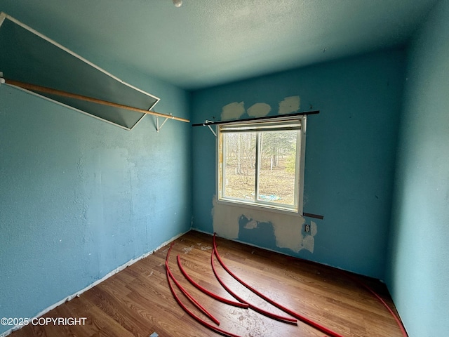 empty room with wood finished floors