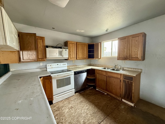 kitchen with white appliances, open shelves, light countertops, brown cabinets, and a sink