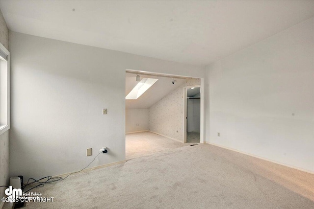 12100 Woodway Cir, Anchorage, AK 99516 - additional living space with carpet floors, vaulted ceiling, and a skylight