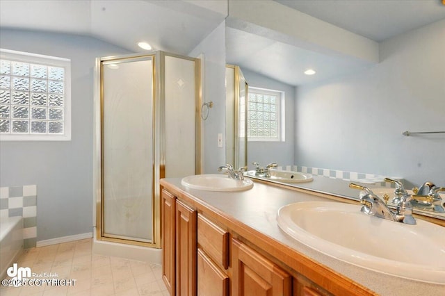 12100 Woodway Cir, Anchorage, AK 99516 - bathroom with vaulted ceiling, a stall shower, double vanity, a bath, and baseboards