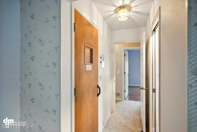 12100 Woodway Cir, Anchorage, AK 99516 - corridor featuring light colored carpet and baseboards