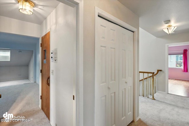 12100 Woodway Cir, Anchorage, AK 99516 - corridor featuring carpet floors, an upstairs landing, and baseboards
