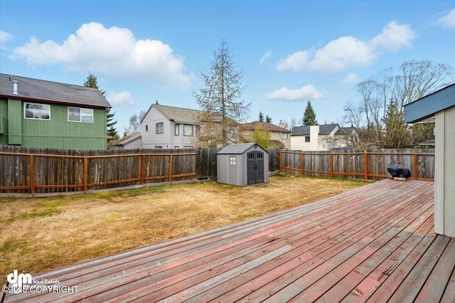 12100 Woodway Cir, Anchorage, AK 99516 - wooden deck with a storage unit, a residential view, and an outbuilding