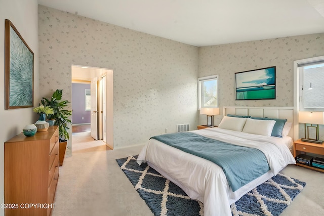 12100 Woodway Cir, Anchorage, AK 99516 - carpeted bedroom featuring multiple windows and wallpapered walls