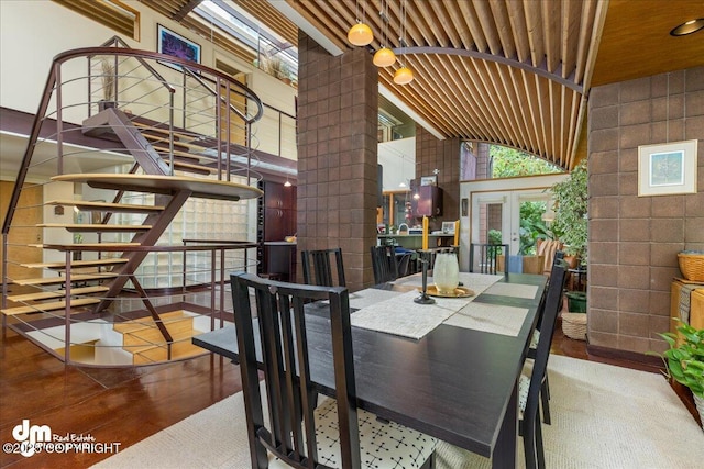 dining space featuring stairway, wooden ceiling, french doors, and lofted ceiling