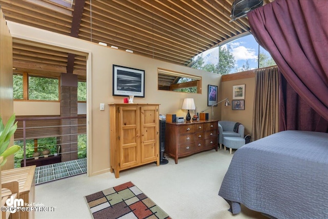 bedroom with vaulted ceiling and light carpet