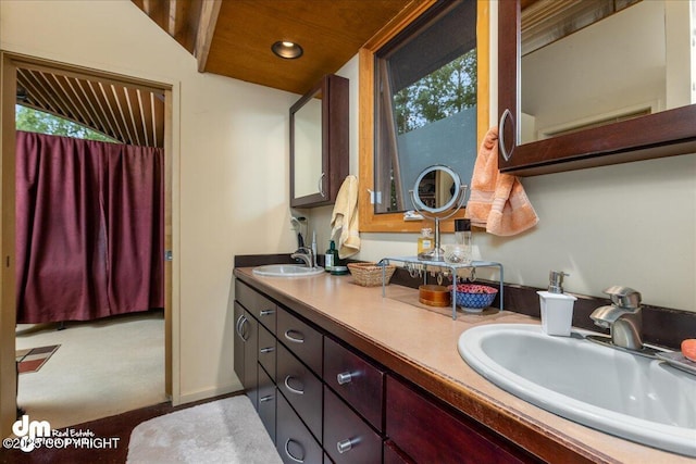full bath with double vanity, recessed lighting, and a sink