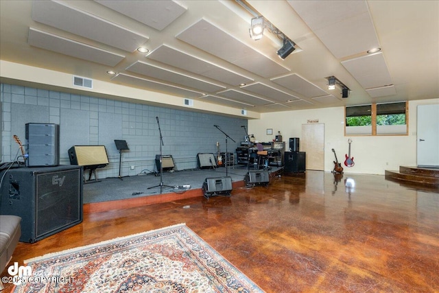 misc room with concrete flooring and visible vents