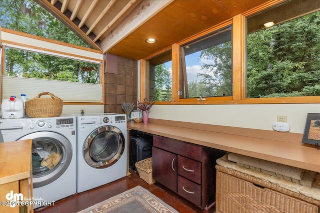 clothes washing area featuring recessed lighting, dark wood finished floors, and washing machine and dryer
