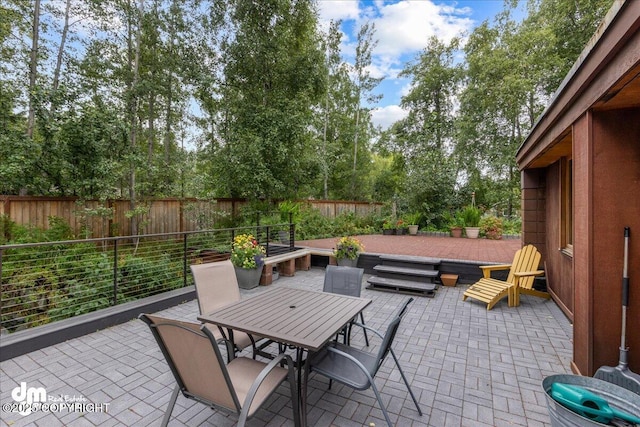 view of patio / terrace featuring outdoor dining area and a fenced backyard