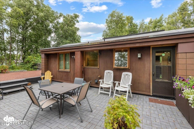 view of patio featuring outdoor dining area