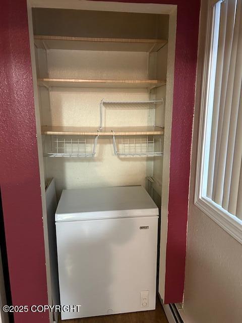 laundry room with a textured wall
