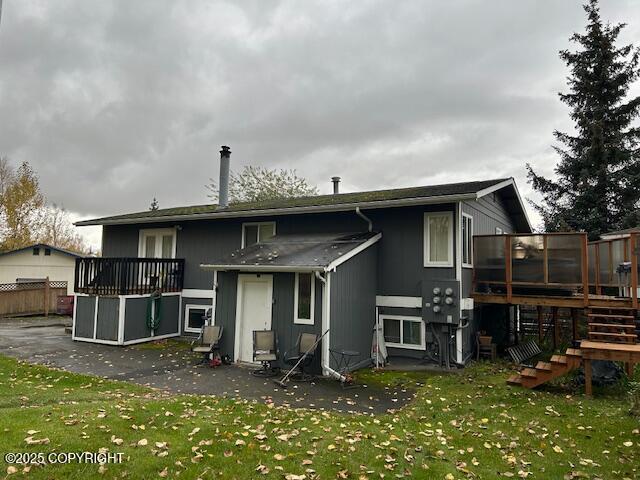 back of property with stairway and a wooden deck