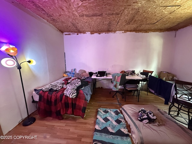 bedroom with wood finished floors