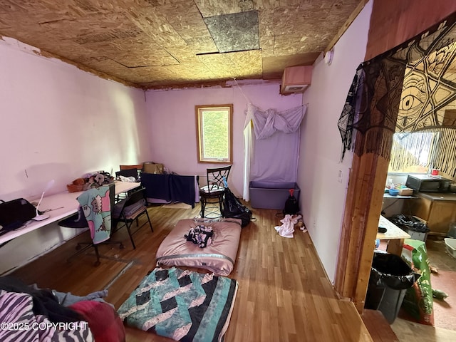 interior space with an ornate ceiling and wood finished floors