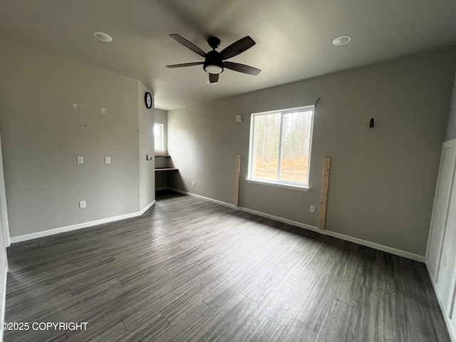 49045 Gemini Ct, Soldotna, AK 99669 - empty room with a ceiling fan, baseboards, and dark wood-type flooring