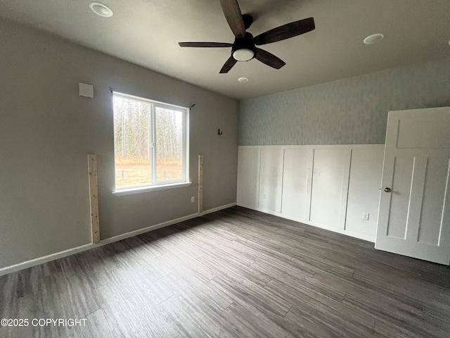 49045 Gemini Ct, Soldotna, AK 99669 - unfurnished room with baseboards, ceiling fan, and wood finished floors